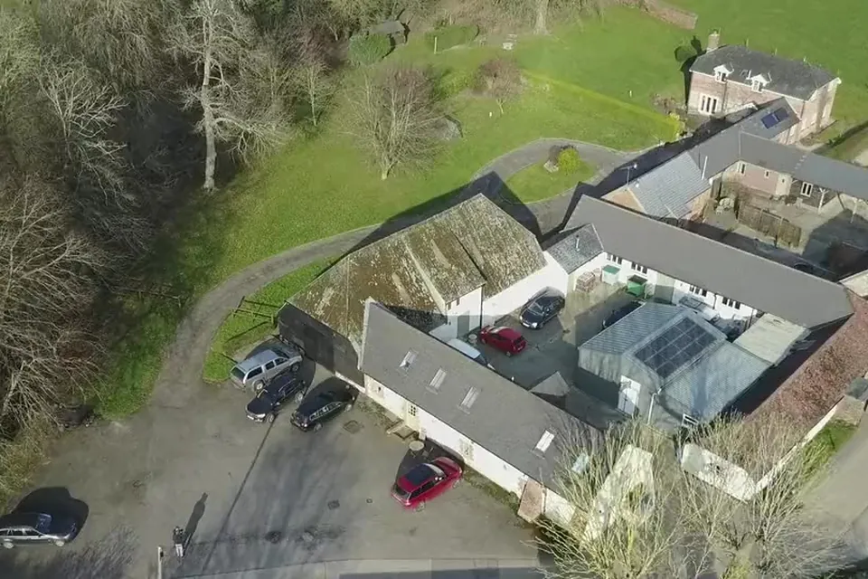 The barn and its yard from the air, near Chichester