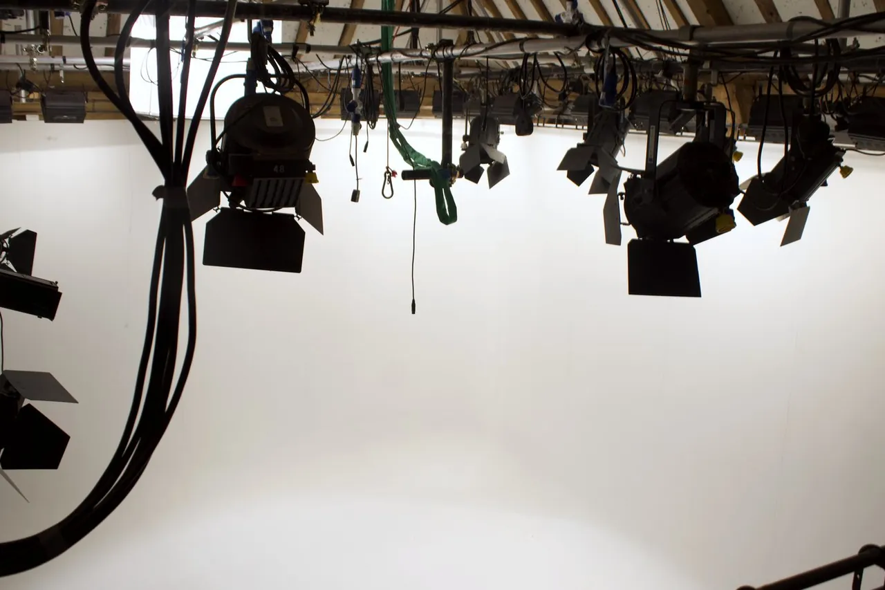 The lighting grid and white cove inside the barn