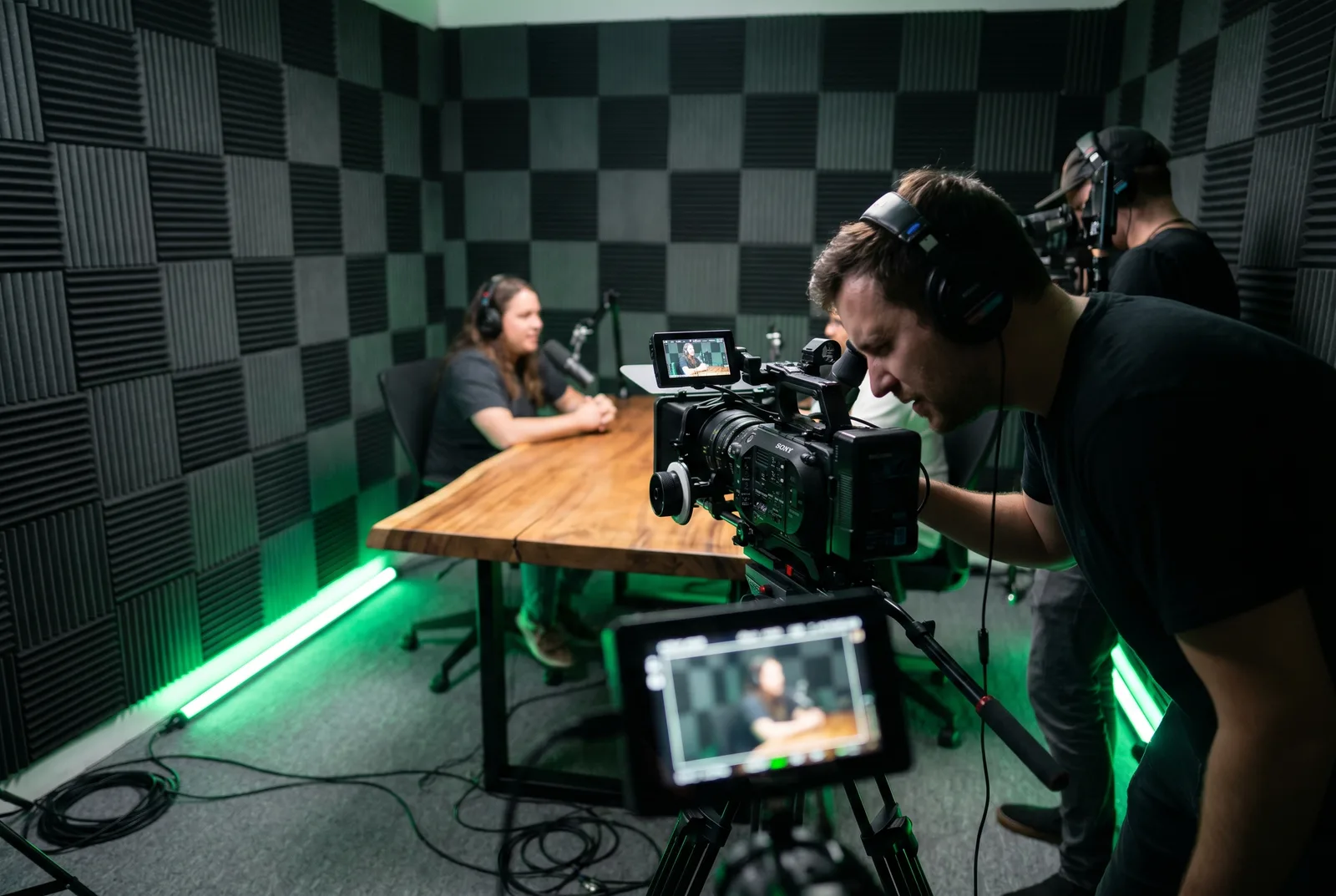 A camera operator framing a shot during a recording session