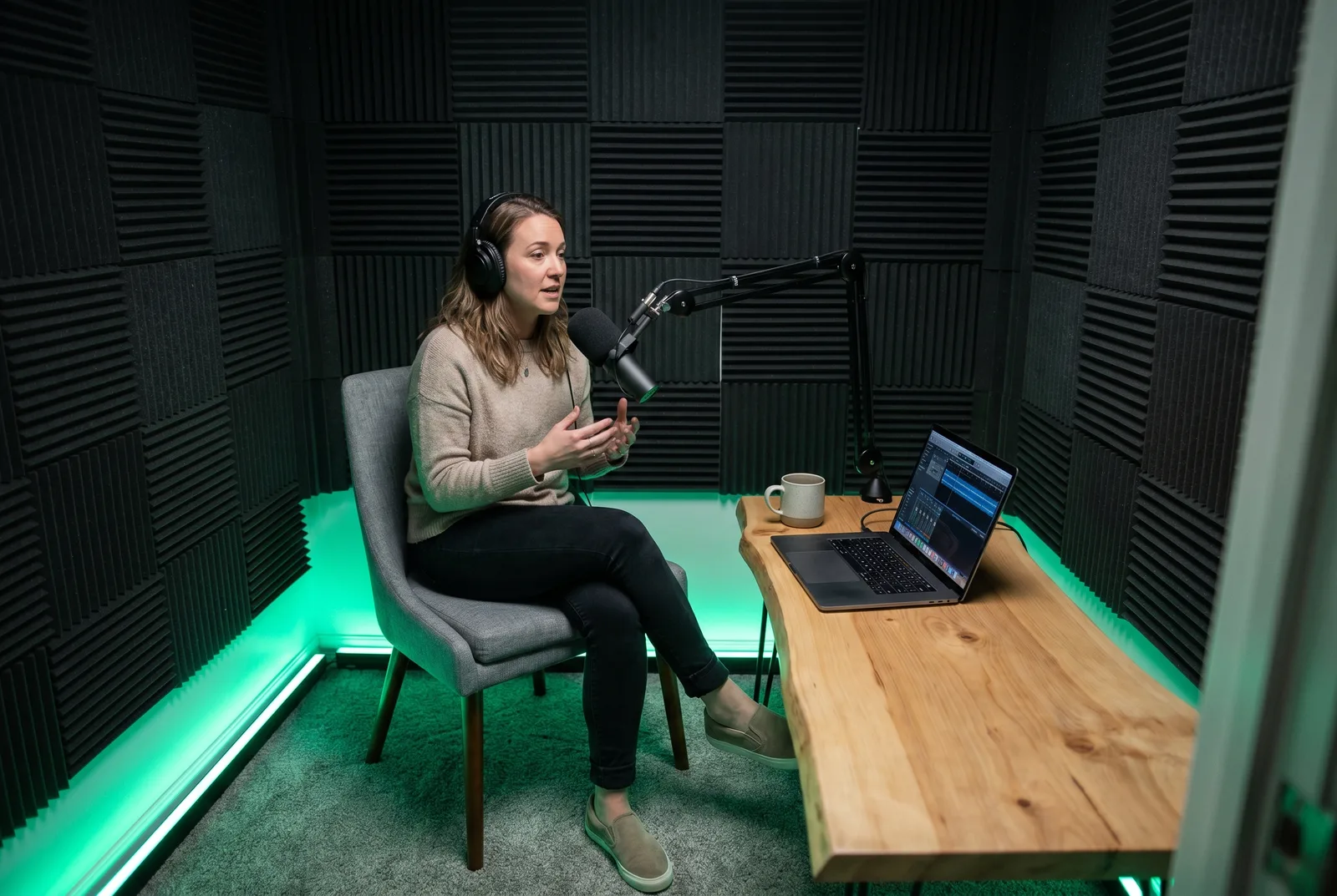 A host recording a solo podcast episode in the studio