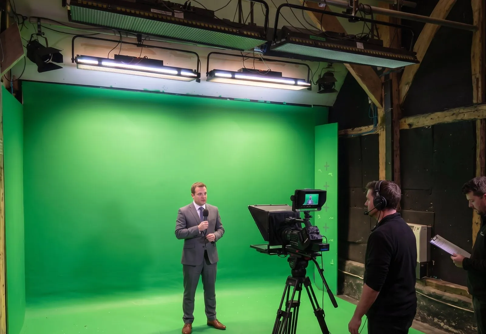 A presenter recording to camera with an autocue